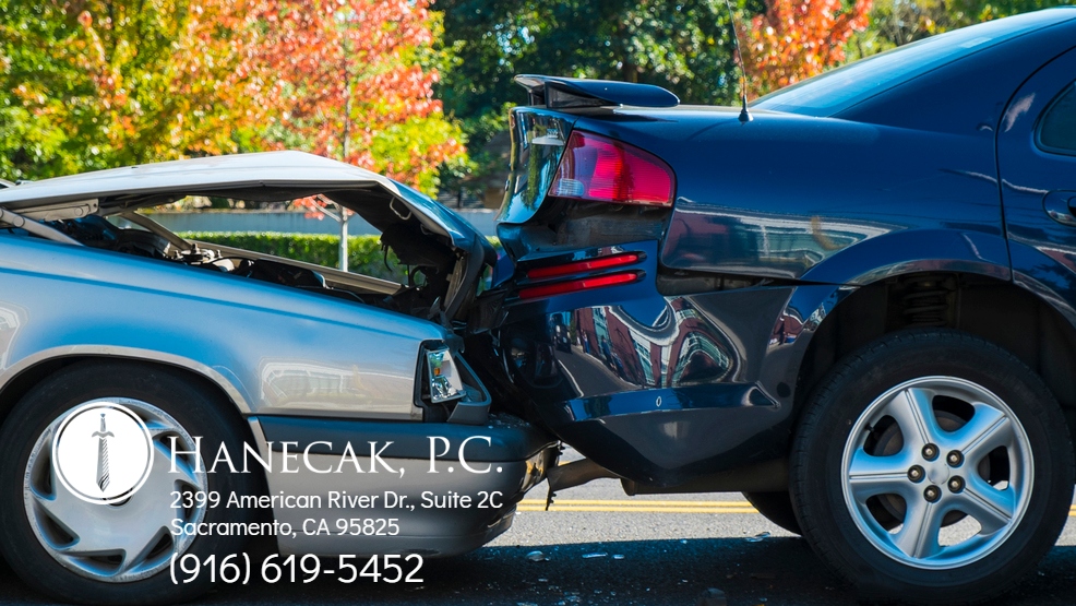 Auto accident involving two cars on a city street